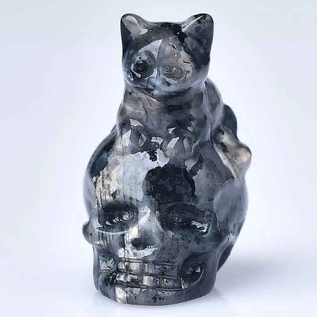 crystal carved cat on skull